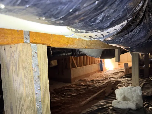 A close look at a floor joist and duct in a crawl space we inspected