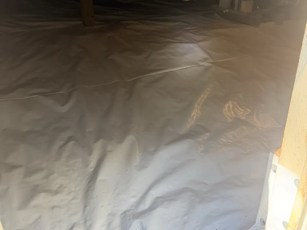 A finished encapsulation: white liner across the floor and up the wall