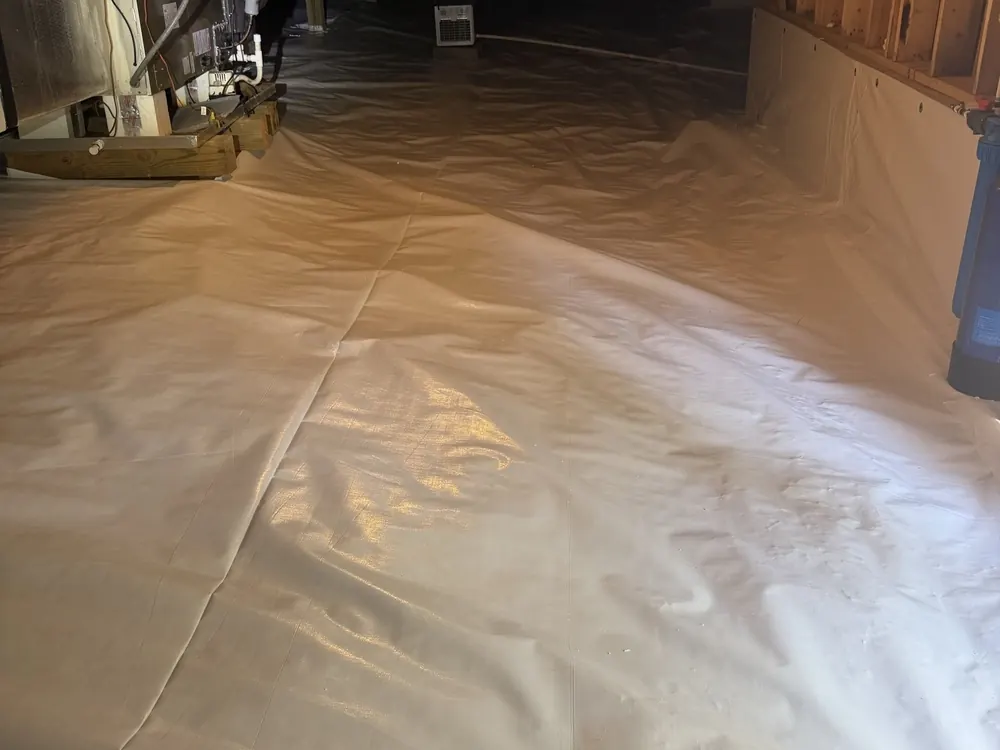 White liner sealed up the foundation wall of a crawl space
