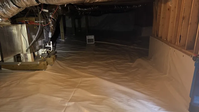 White liner sealed up a crawl space wall after encapsulation